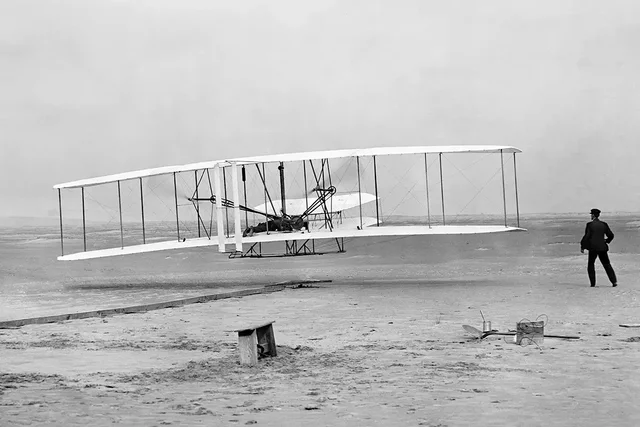First powered airplane piloted