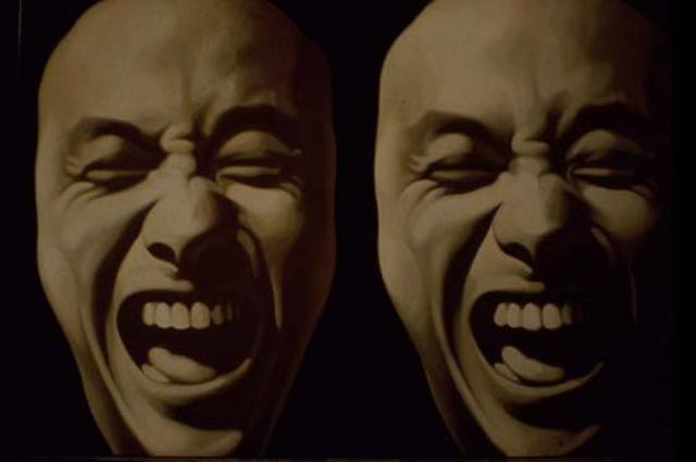 he was inspired by a painting by Geng Jianyi in the "China / Avant Garde" show in Beijing, which depicted Geng's own laughing face.