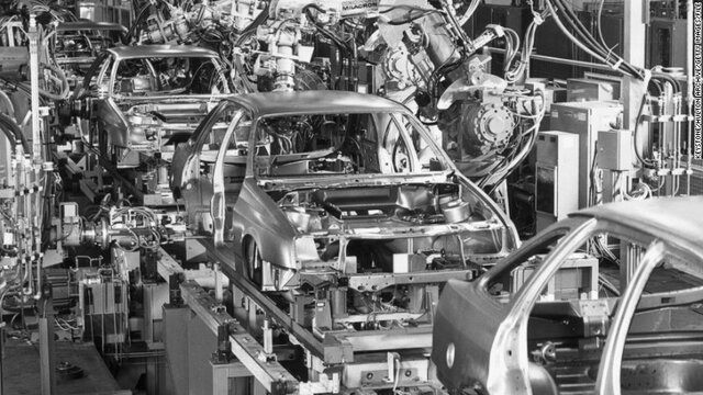 spot-welding robots enter the assembly line