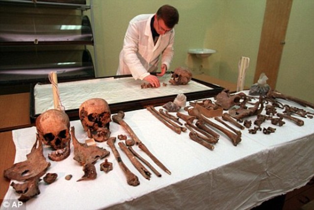 The remains of Nicholas II and his family are exhumed; two of the imperial children are not found in the mass grave.