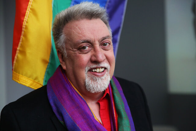 (L)  Gilbert Baker designs and creates the first rainbow flag.