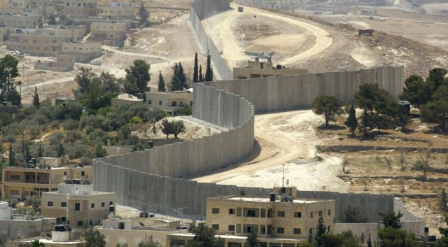 Barrier wall construction around West Bank