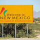 New mexico welcome sign roadside outdoors sunny day stat motto land enchantment 60954981