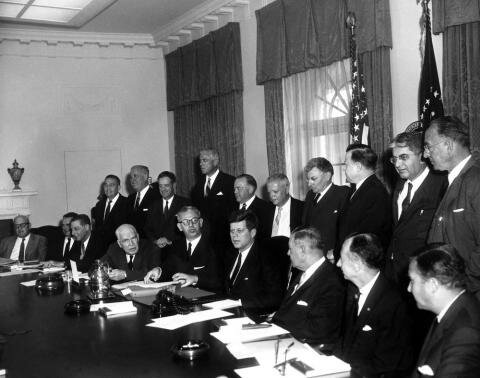 President John F. Kennedy signs th Fair Labor Standards Act