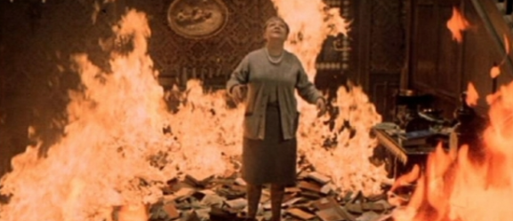 Montag Takes a Book From the Burning House