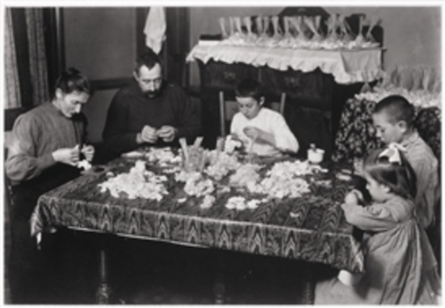 Hine finishes his work with incoming immigrants.