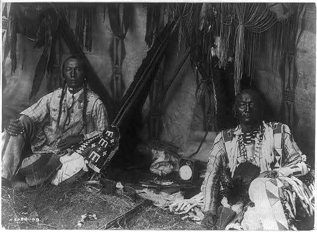 Edward Curtis, In a Piegan Lodge (Little Plume and son Yellow Kidney), original and edited version of photograph, c. 1910. Library of Congress (in Meier)