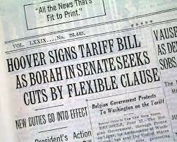 he Smoot-Hawley Tariff Act is signed by President Herbert Hoover
