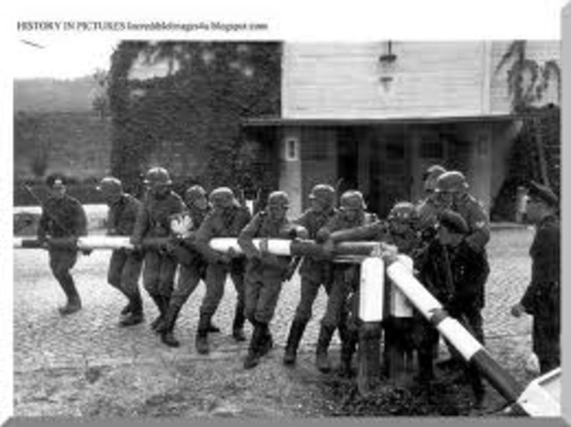 German troops under Adolf Hitler seize Austrian lands and announced its union with Germany