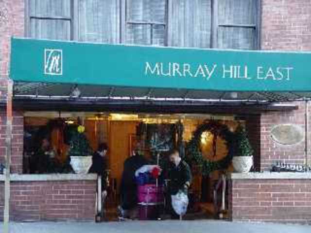 Arrives at the Murray Hill Hotel