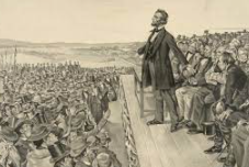 Abraham Lincoln delivers the Gettysburg Address.