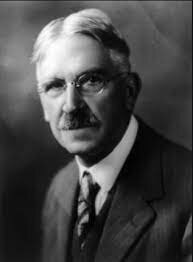 N.E. John Dewey