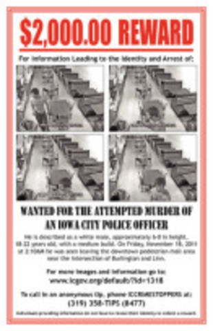 UI student and friend of suspect in the choking of an UI police officer is cited for tearing down wanted posters in local businesses