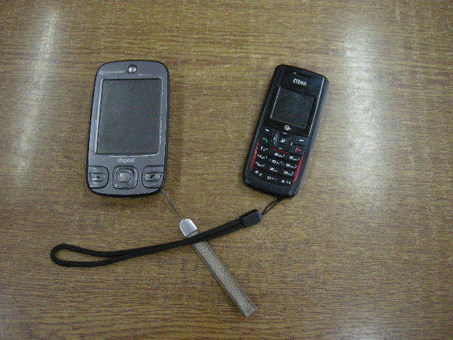 Two mobile phones in use