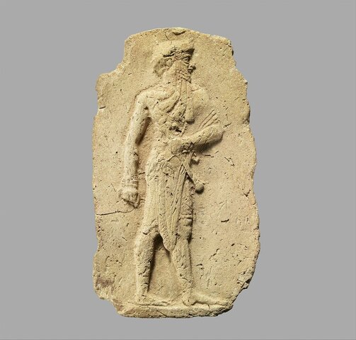 Molded plaque: king or a god carrying a mace - Mesopotamia