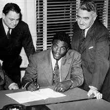 Jackie Robinson signs contract with the Montreal Royals