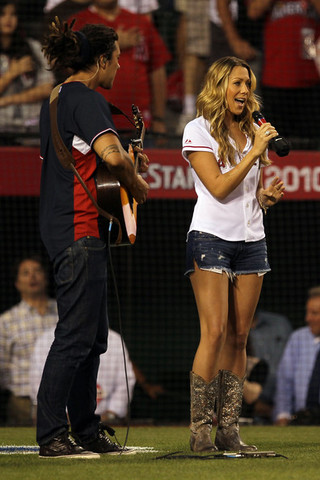 She performed "God Bless America" during the 7th inning stretch at the 2010 Major League All-Star Baseball game. (not the right day)