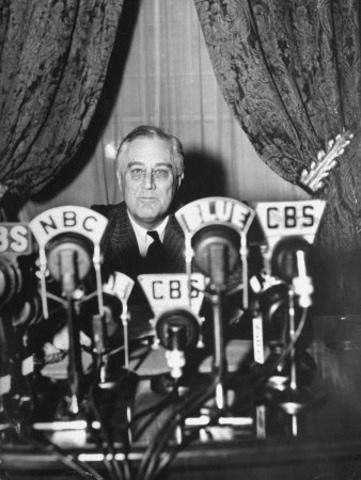 Franklin D. Roosevelt gives first fireside chat