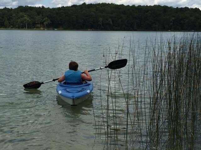 At the lake kayaking for the first time at 11.