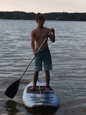 Stand up paddle boarding at the lake at 14