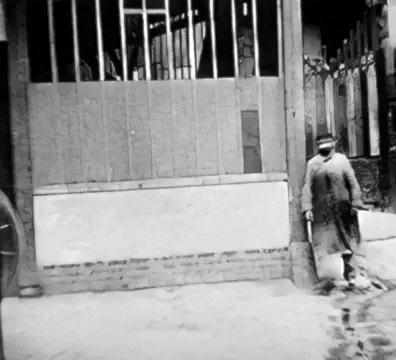 Man Walking Around a Corner