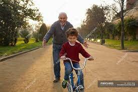 My grandpa teaching me how to ride a bike