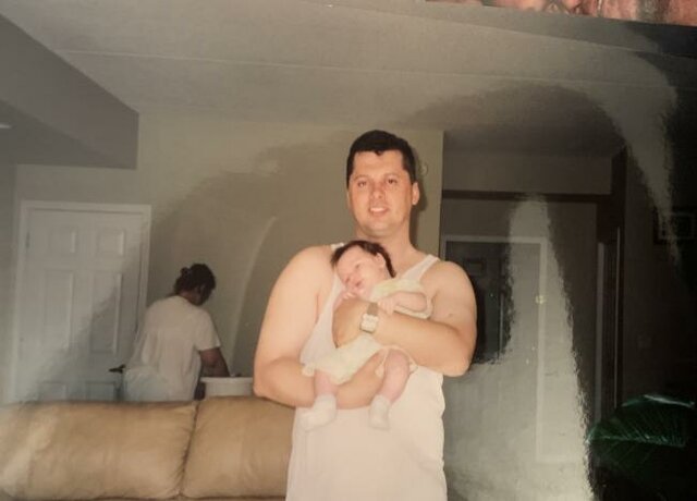 My dad holding me