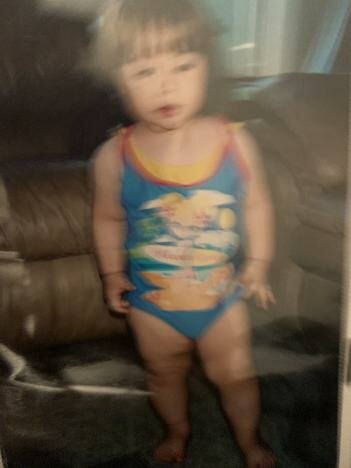 Going into a kid pool with my older sister