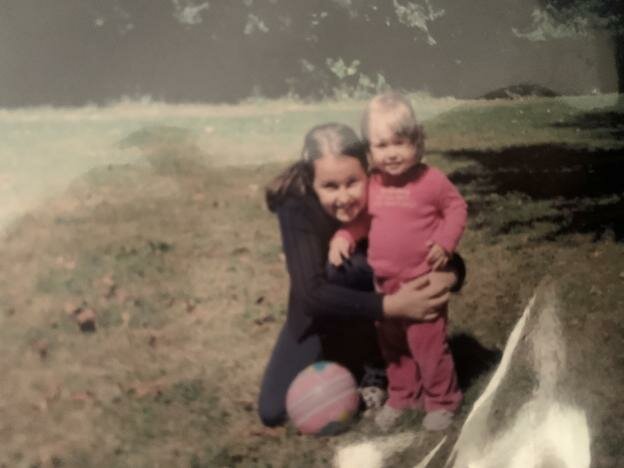 My older sister hugging me