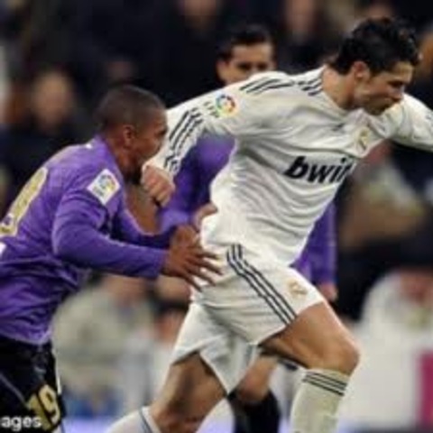 Breaks Patrick Mtiliga's nose