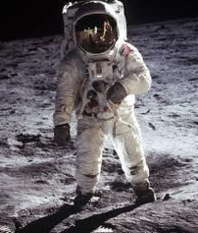 He delivers a speech saying the US will put a man on the moon "before the end of this decade."