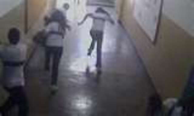 Gunman fires at former school