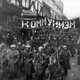 Armed soldiers carry a banner reading 'communism', nikolskaya street, moscow, october 1917