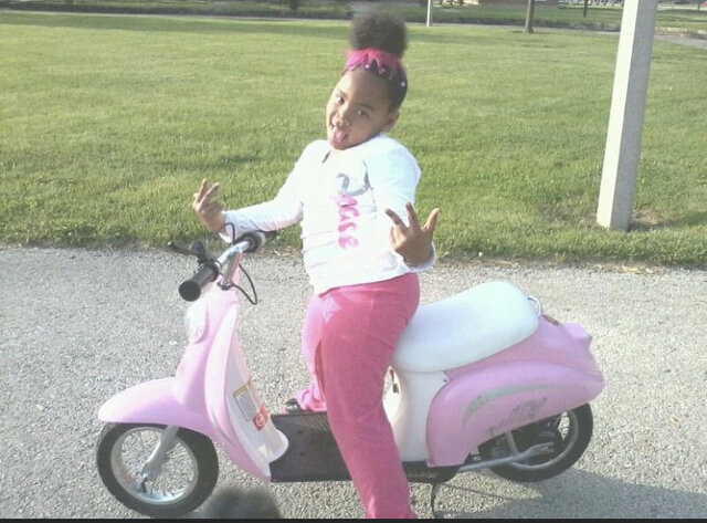 Pink motor scooter
