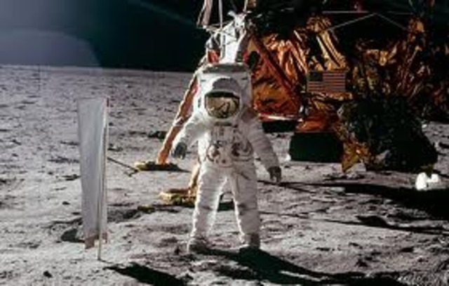 Buzz aldrin and Neil Armstrong putting flag on the moon