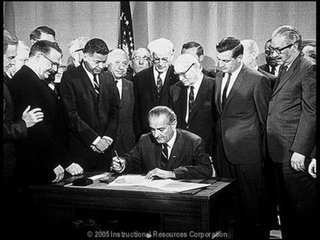 President Johnson signs civil rights act