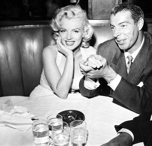 DiMaggio and Monroe divorce.