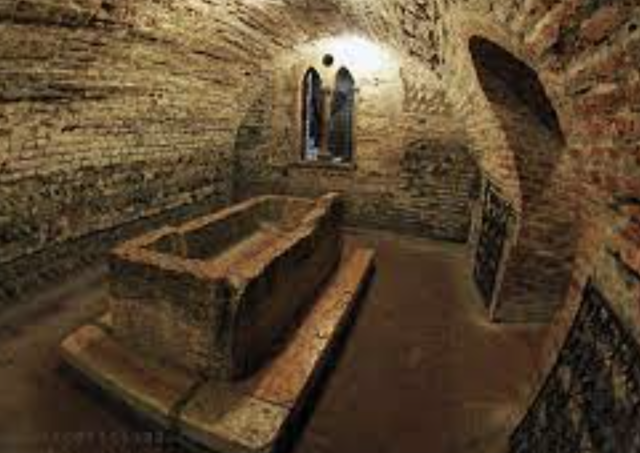 Paris visits Juliet's tomb with his servant and mourns over her body when Romeo arrives