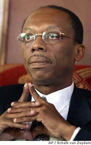 Former Haitian President Jean-Bertrand Aristide flees the country