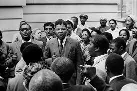 Nelson Mandela is charged for treason