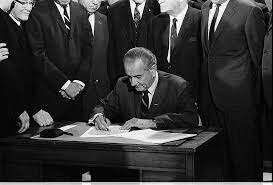 LBJ Signs Jobs Bill