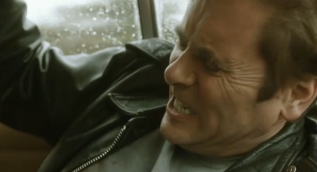 shows harry venn injured in the back of the car