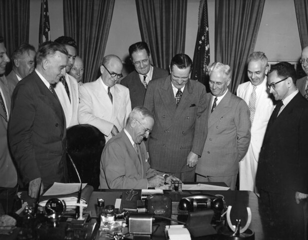 President Truman signs the Organic Act of Guam