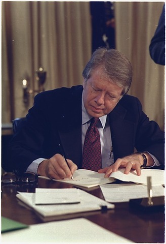 Jimmy Carter signs in Reorganization Plan Number 3