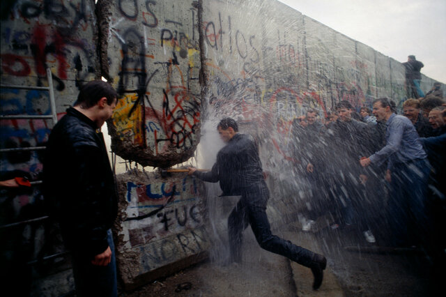 Berlin Wall is torn down, a year later Germany is reunified