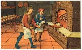 Gremios de artesanos y comerciantes en las ciudades medievales, que establecían reglas laborales.