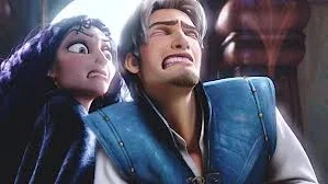 Flynn tries to save Rapunzel but gets stabbed by mother Gothel