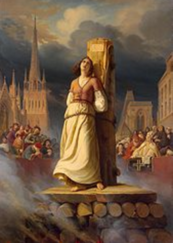 Joan is burned at a stake