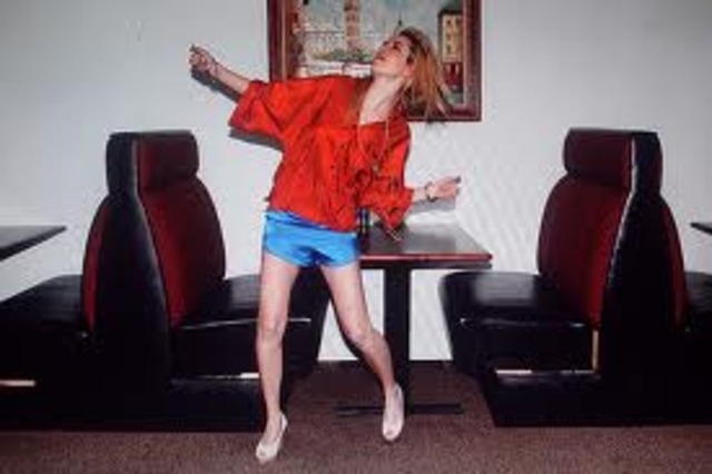 Tight fitted trousers and shorts, neon colour clothes, t-shirts, sweatshirts, black leather jackets, 'the catsuite', tartan skirts, trench coats lined with fur, high waisted trousers and shorts.