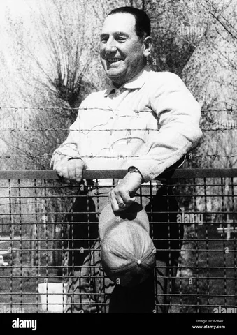 Juan Perón, in exile in Spain, retrieves Eva's embalmed body, and it is returned to him.